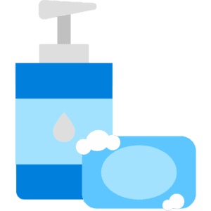 Blue pump soap bottle beside a blue bar of soap with bubbles.