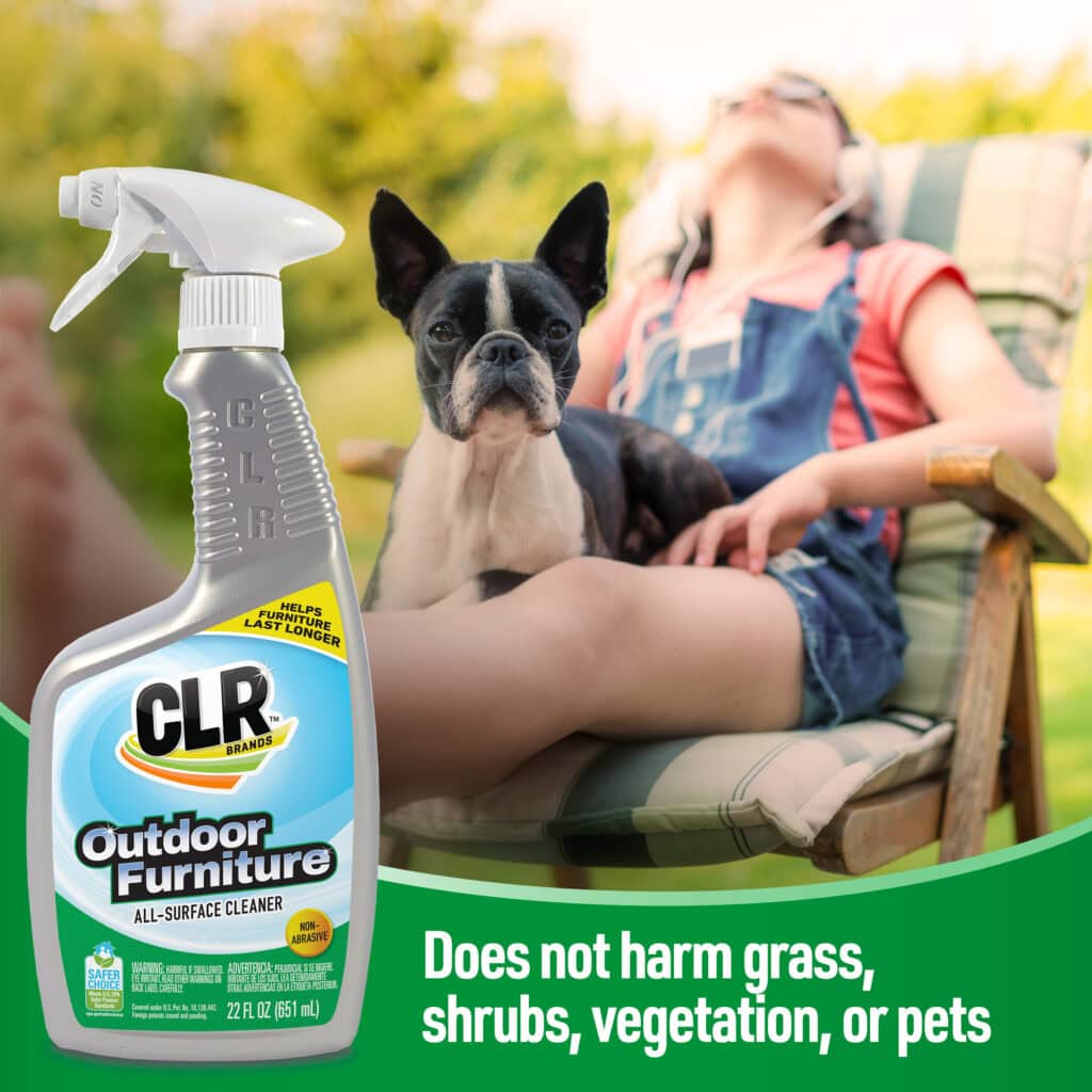 CLR Outdoor Furniture Cleaner bottle in foreground; dog and person relax in garden. Safe for pets and grass.