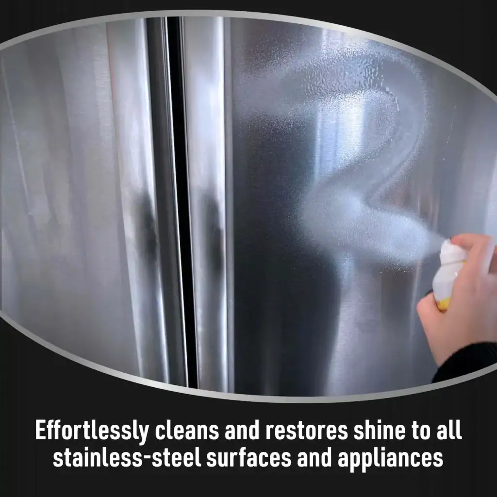 Person cleaning a stainless steel surface with a spray bottle, highlighting the surface's shine and cleanliness for kitchen appliances.
